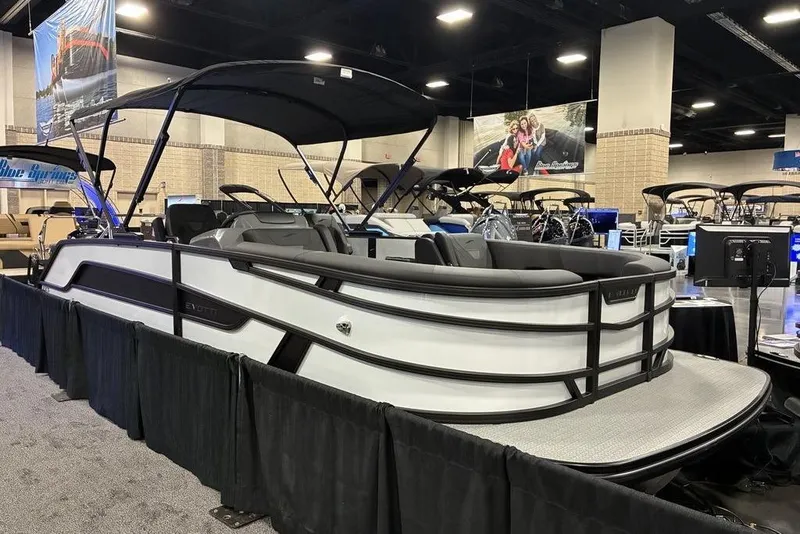 The Image of 2026 Evotti 523CS luxury pontoon boat displayed at an indoor boat show. - 0