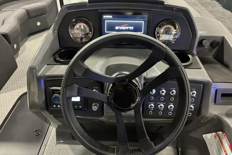Slide: The Image of Steering console of 2026 Evotti 523CS boat with modern controls and display. - 4