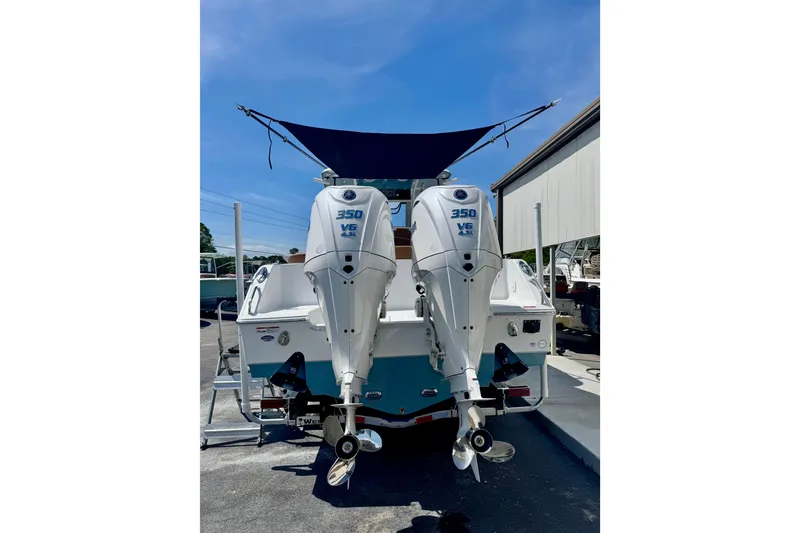 Slide: The Image of 2025 Sea Hunt Ultra 305 SE with twin 350 V6 engines, rear view. - 2