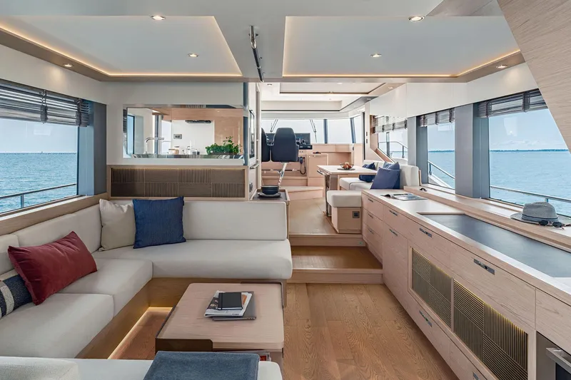 Slide: The Image of Manufacturer Provided Image: Luxurious interior of 2025 Beneteau Grand Trawler 63 yacht with modern furnishings and ocean view. - 2