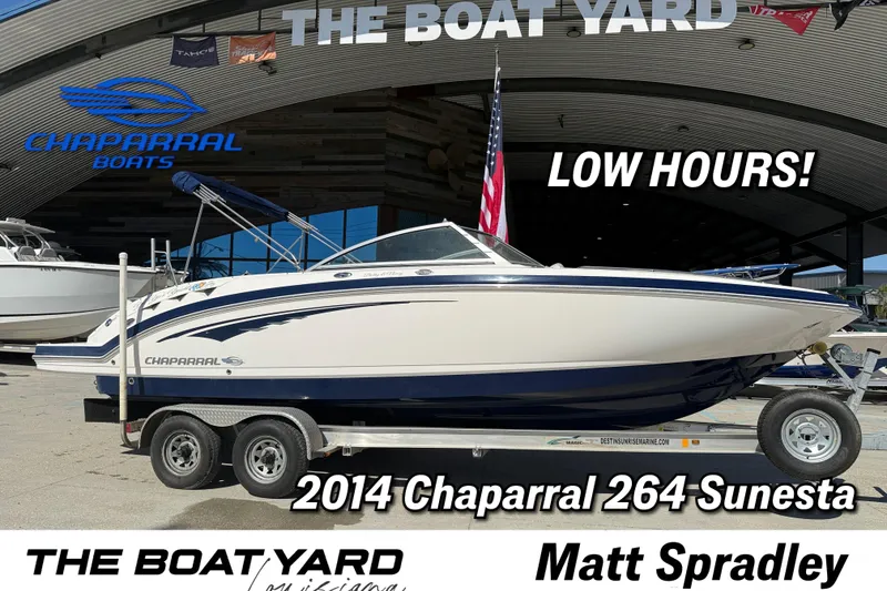 The Image of 2014 Chaparral 264 Sunesta boat on trailer, low hours, displayed at The Boat Yard. - 1