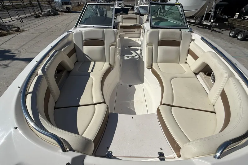 Slide: The Image of 2014 Chaparral 264 Sunesta boat interior with spacious seating and sleek design. - 10