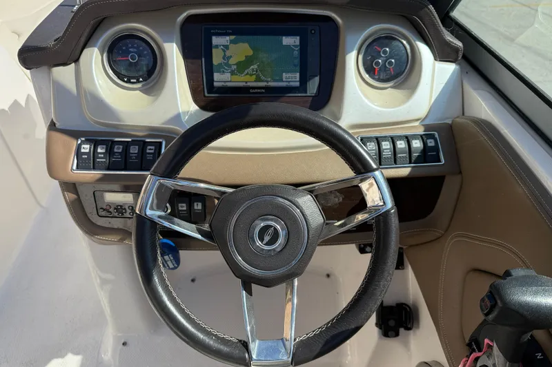 Slide: The Image of Steering console of 2014 Chaparral 264 Sunesta with GPS and control panel. - 15