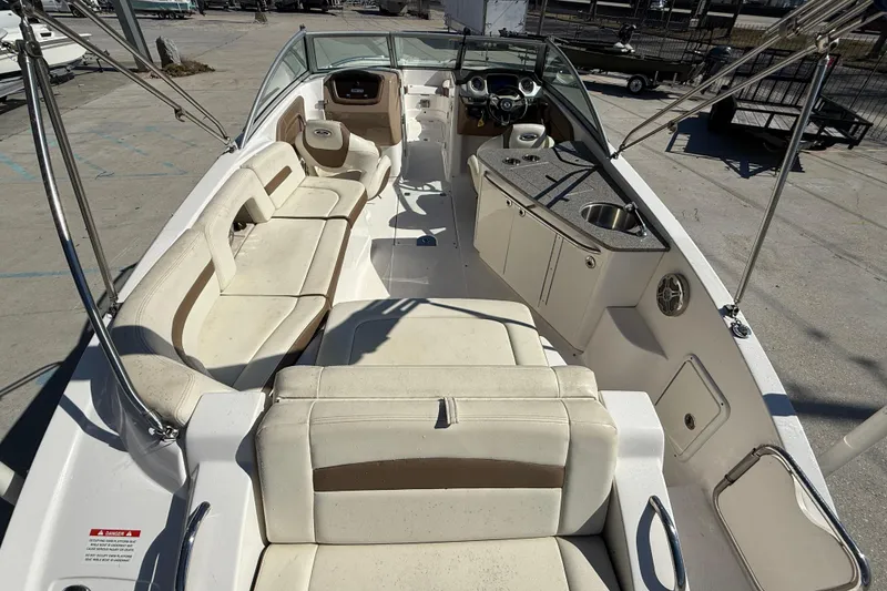 Slide: The Image of 2014 Chaparral 264 Sunesta boat interior with seating and kitchenette. - 8