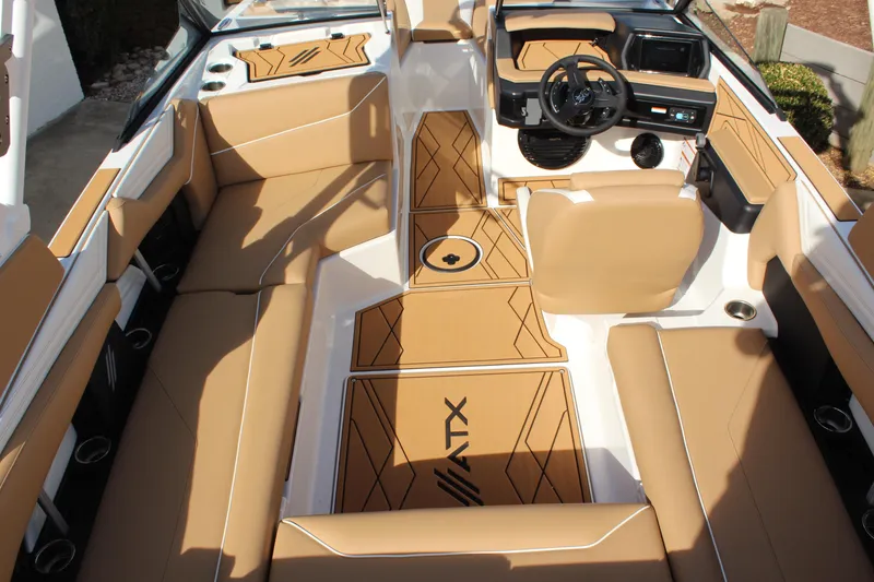 Slide: The Image of 2026 ATX Surf Boats 22 Type-S interior with tan seating and modern dashboard design. - 13