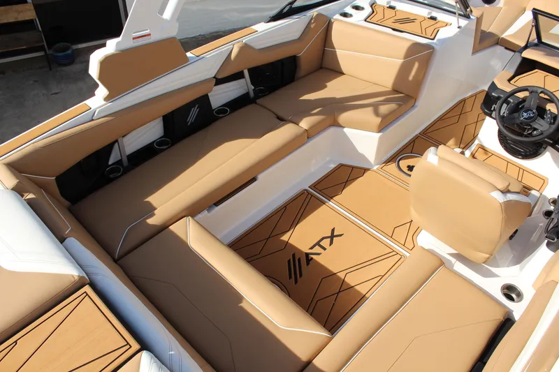 Slide: The Image of 2026 ATX Surf Boats 22 Type-S interior with tan seating and modern design. - 14