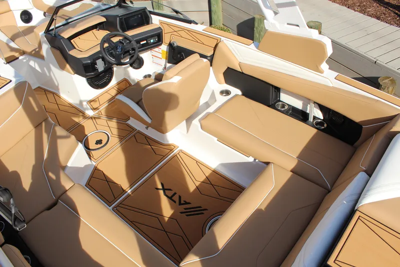 Slide: The Image of 2026 ATX Surf Boats 22 Type-S interior with tan seating and modern dashboard design. - 15