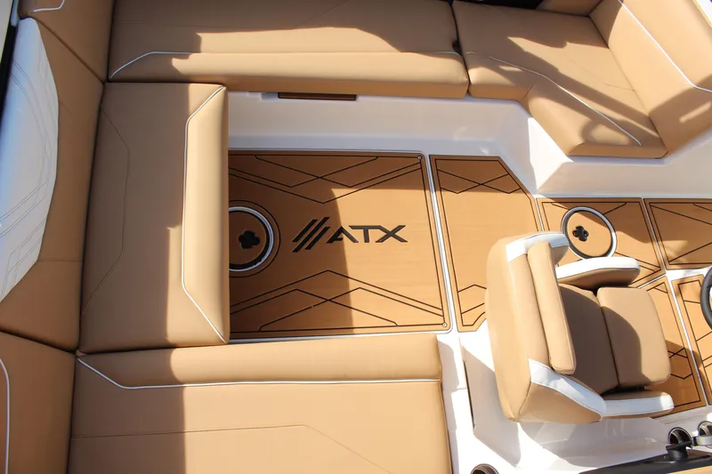 Slide: The Image of 2026 ATX Surf Boats 22 Type-S interior with tan seating and custom flooring. - 16
