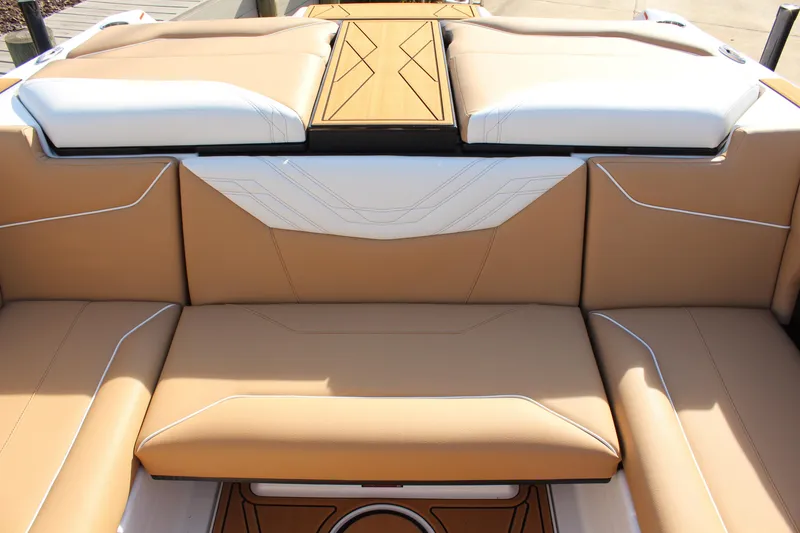 Slide: The Image of 2026 ATX Surf Boats 22 Type-S interior with tan and white seating. - 17