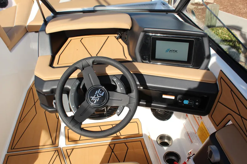 Slide: The Image of 2026 ATX Surf Boats 22 Type-S dashboard with steering wheel and touchscreen display. - 18