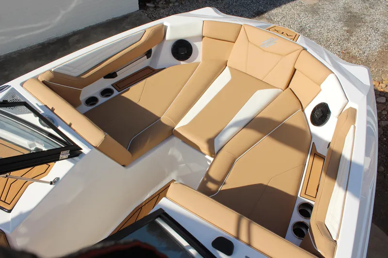 Slide: The Image of 2026 ATX Surf Boats 22 Type-S interior with tan seating and cup holders. - 3