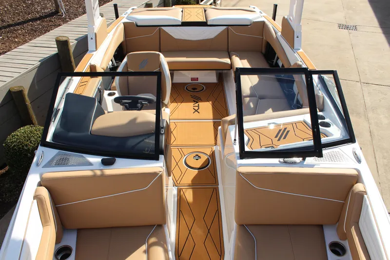 Slide: The Image of 2026 ATX Surf Boats 22 Type-S interior with tan seating and open windshield. - 4
