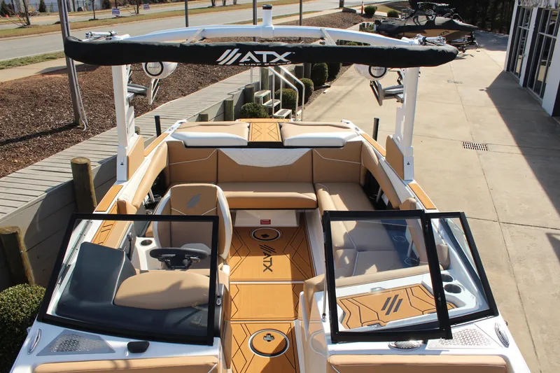 Slide: The Image of 2026 ATX Surf Boats 22 Type-S interior with tan seating and open windshield. - 5