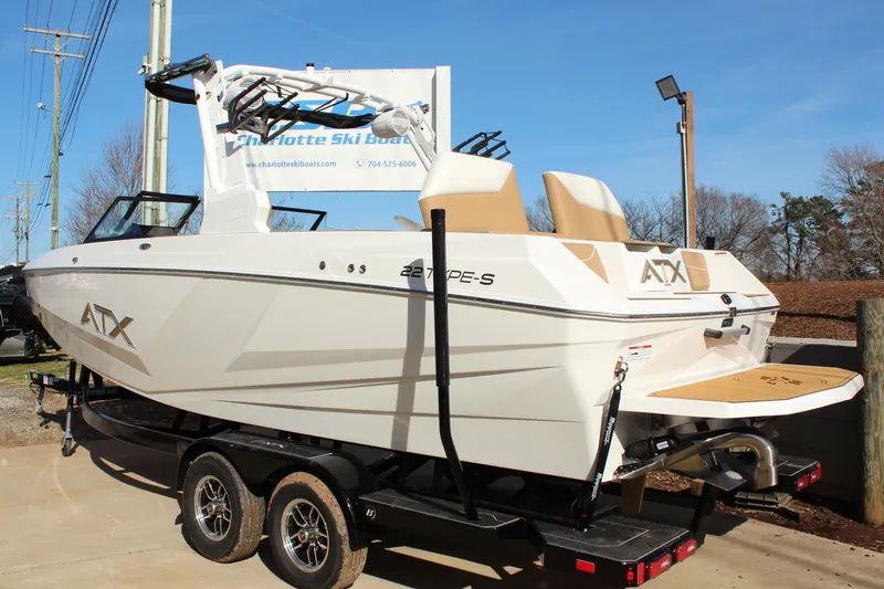 Slide: The Image of 2026 ATX Surf Boats 22 Type-S on trailer, displayed outdoors at Charlotte Ski Boats. - 8