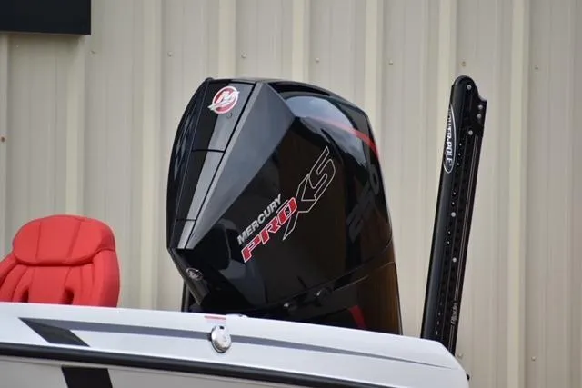 Slide: The Image of 2024 iKon LX21 boat with Mercury Pro XS engine, red seat, and power pole. - 4