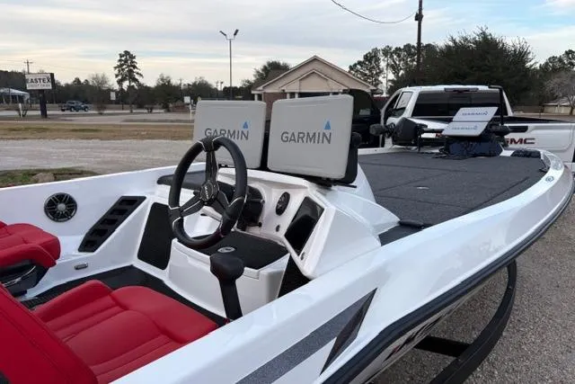 Slide: The Image of 2024 iKon LX21 boat with Garmin navigation, red seats, and sleek design. - 9