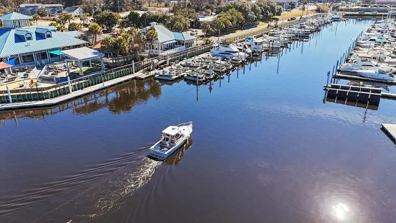 Slide: The Image of Albemarle 28 Express 2002 boat in marina, sunny day. - 28