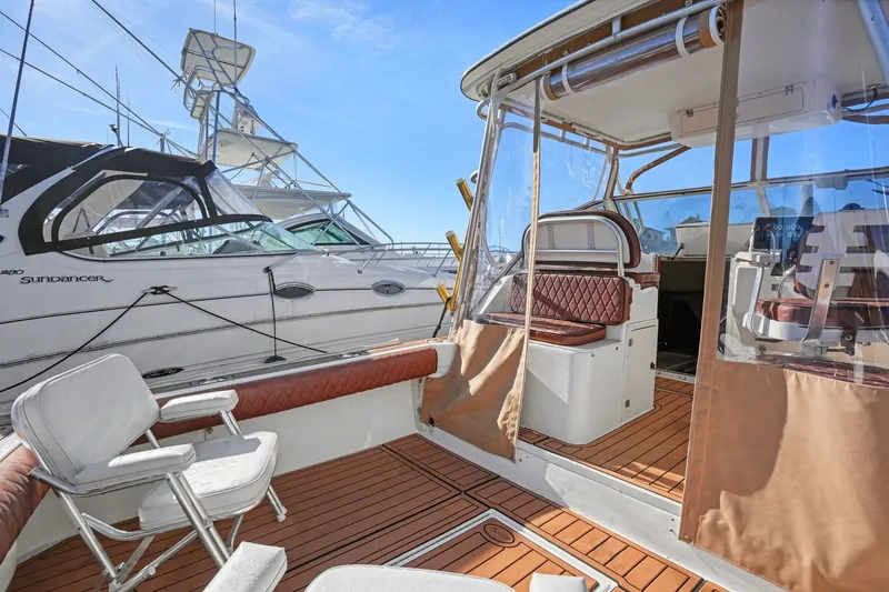Slide: The Image of 2002 Albemarle 28 Express boat with teak deck and seating area. - 7