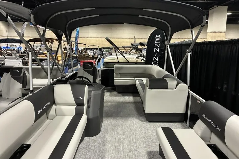 Slide: The Image of 2025 Bennington S L-Bench 20 SL pontoon boat with spacious seating and sleek design. - 4