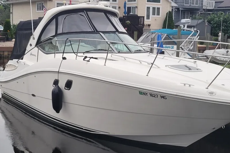 The Image of 2008 Sea Ray Sundancer 330 docked, showcasing sleek design and modern features. - 0