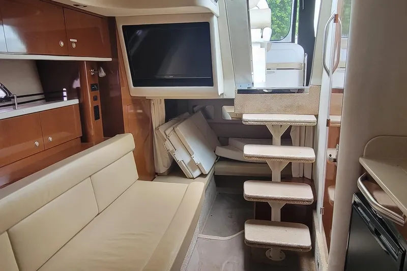 Slide: The Image of Interior of 2008 Sea Ray Sundancer 330 yacht with stairs, sofa, and TV. - 10