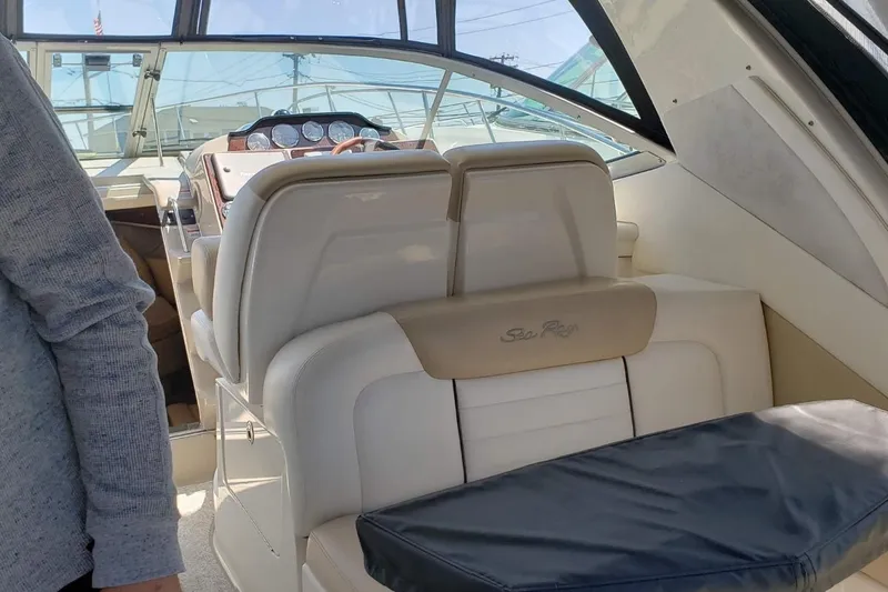 Slide: The Image of Interior of a 2008 Sea Ray Sundancer 330 boat with leather seating and dashboard. - 4