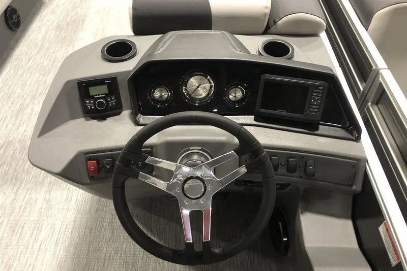 Slide: The Image of 2026 Bennington S Quad Bench 22 SSR SPS boat dashboard with steering wheel and controls. - 5