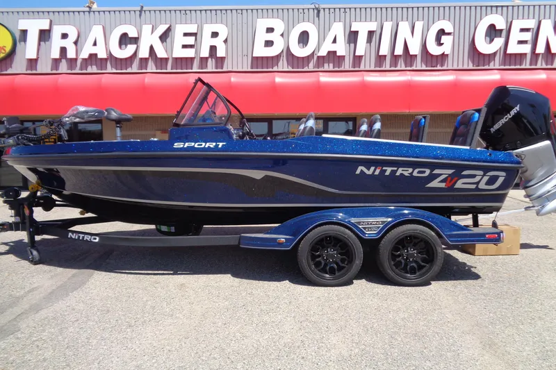 The Image of 2025 Nitro ZV20 Sport boat at Tracker Boating Center, blue with trailer. - 0