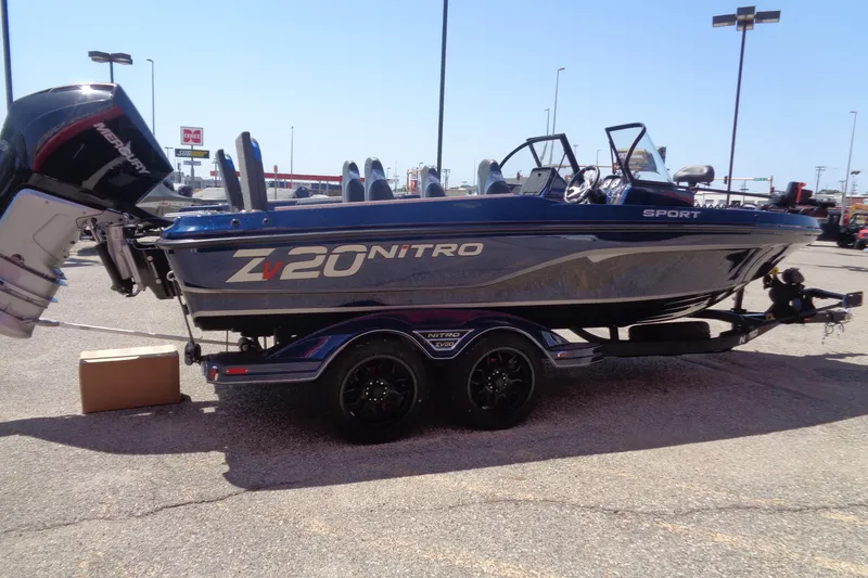 Slide: The Image of 2025 Nitro ZV20 Sport boat on trailer in parking lot, side view. - 3