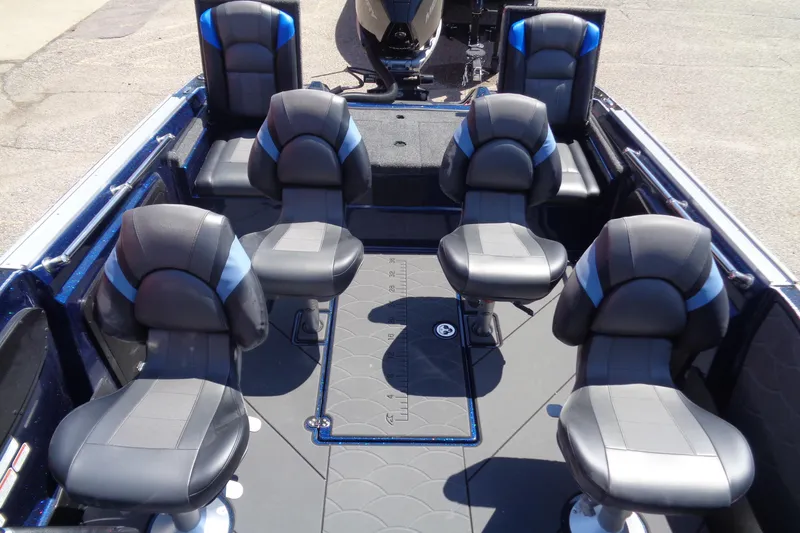 Slide: The Image of 2025 Nitro ZV20 Sport boat interior with six black and blue cushioned seats. - 7