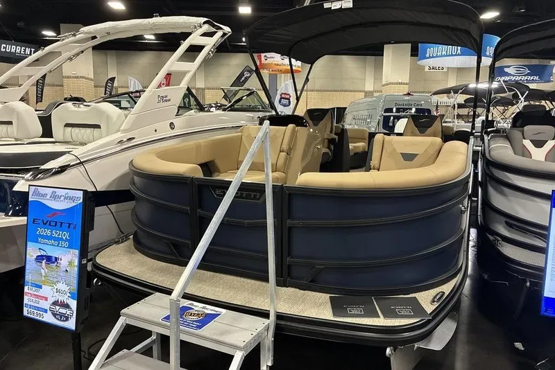 The Image of 2026 Evotti 521QL boat with Yamaha 150 engine displayed at a boat show. - 0