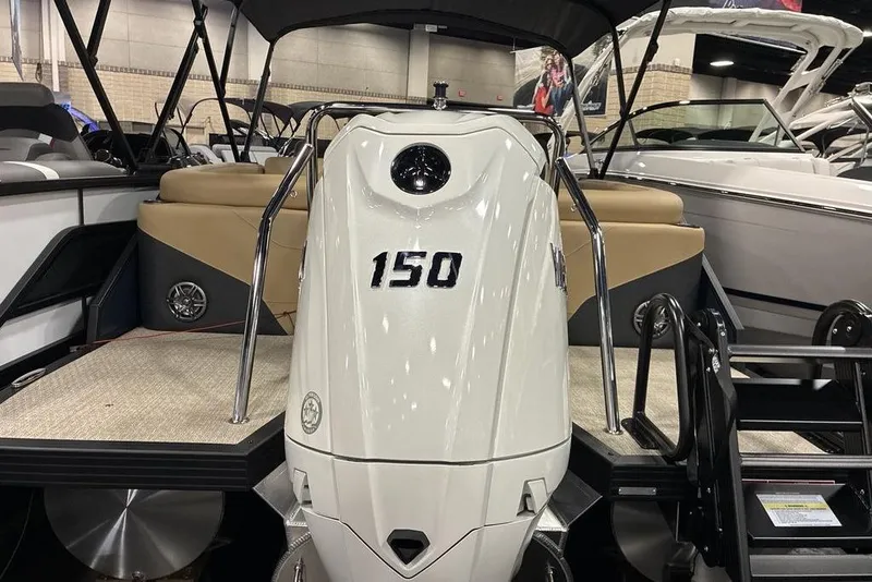 Slide: The Image of 2026 Evotti 521QL boat with 150 horsepower engine, showcased indoors. - 6