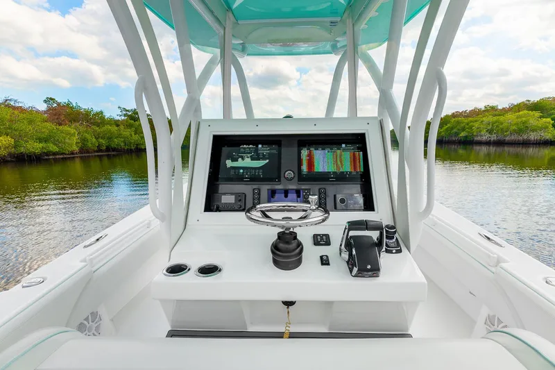 Slide: The Image of 2024 SeaHunter 28 Floridian boat console with advanced navigation and control systems. - 10