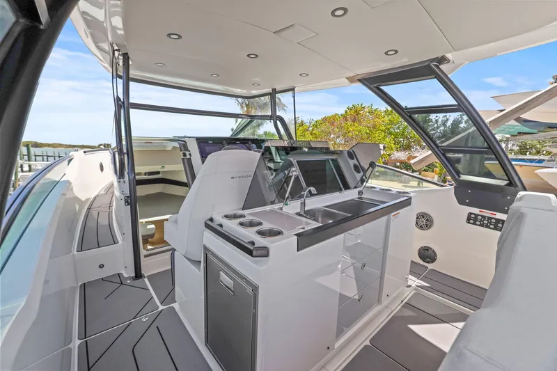 Slide: The Image of 2025 Saxdor 320 GTO yacht interior with modern cockpit and sleek design. - 11