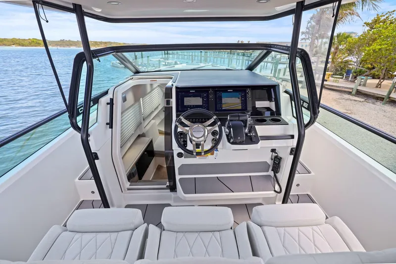 Slide: The Image of Interior view of 2025 Saxdor 320 GTO boat cockpit with modern controls and seating. - 14