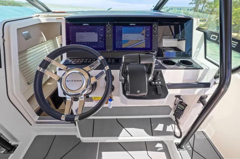 Slide: The Image of 2025 Saxdor 320 GTO helm with modern controls and dual navigation screens. - 15