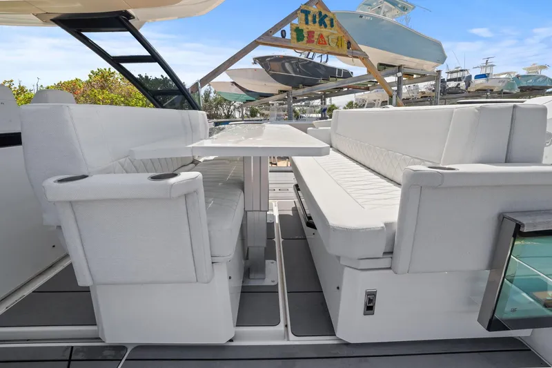 Slide: The Image of Luxurious seating area on the 2025 Saxdor 320 GTO yacht, featuring elegant white upholstery. - 22