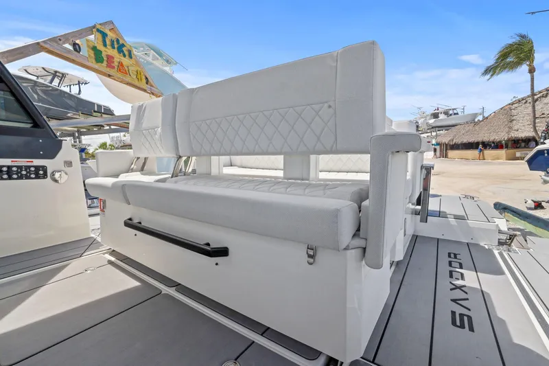 Slide: The Image of 2025 Saxdor 320 GTO boat interior with modern seating and sleek design. - 23