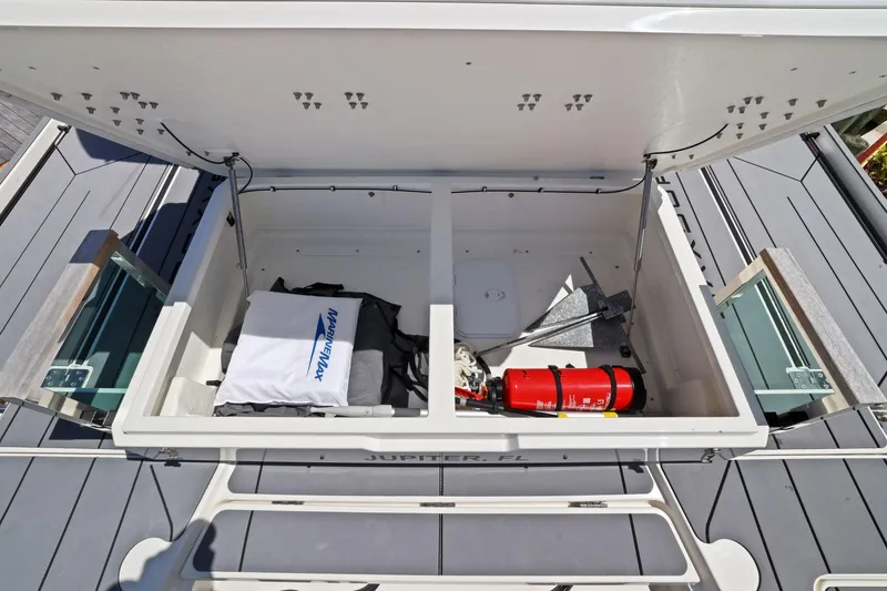 Slide: The Image of Storage compartment of 2025 Saxdor 320 GTO boat with safety equipment and gear. - 43