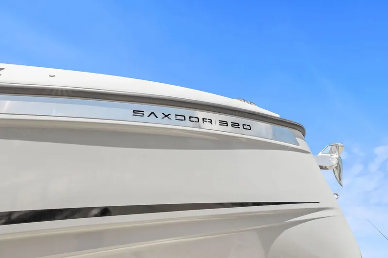 Slide: The Image of 2025 Saxdor 320 GTO boat exterior with clear blue sky background. - 6