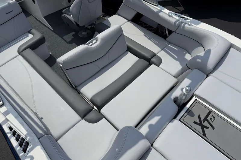 Slide: The Image of 2020 MasterCraft XT23 boat interior with luxurious seating and modern design. - 10