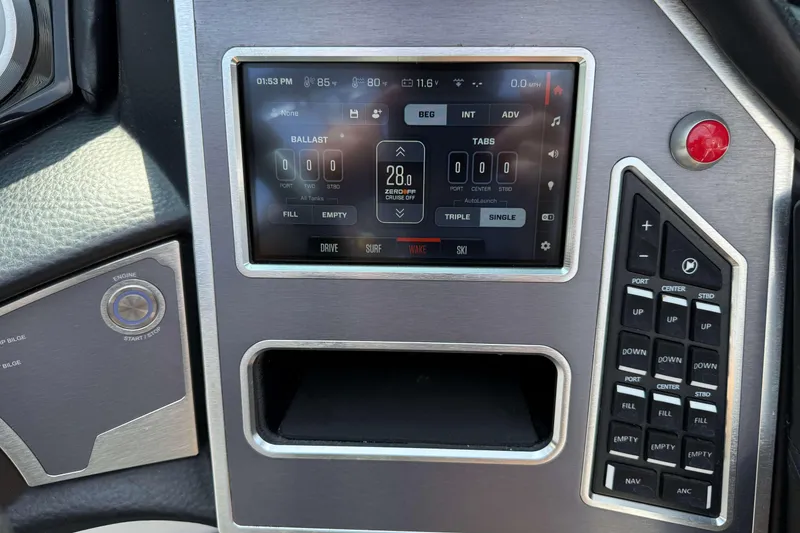 Slide: The Image of 2020 MasterCraft XT23 dashboard with touchscreen controls and ballast settings. - 14