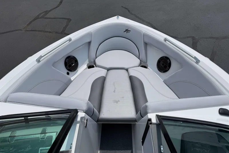 Slide: The Image of 2020 MasterCraft XT23 boat interior with gray seating and speakers. - 15