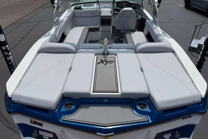 Slide: The Image of 2020 MasterCraft XT23 boat interior with spacious seating and modern design. - 2