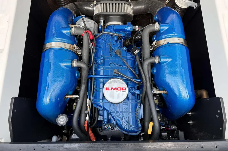 Slide: The Image of 2020 MasterCraft XT23 Ilmor engine with blue components and visible branding. - 28