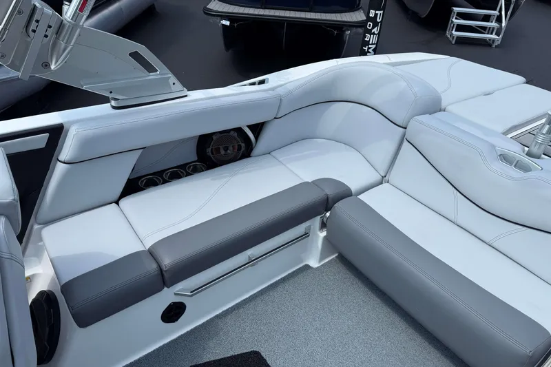 Slide: The Image of 2020 MasterCraft XT23 boat interior with sleek gray and white seating. - 8