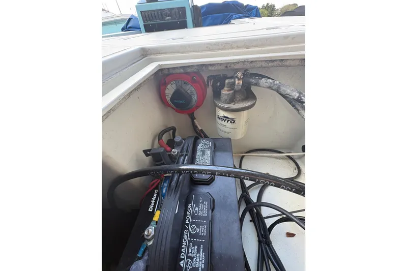Slide: The Image of 1994 Hewes Redfisher 18 boat battery compartment with Sierra filter and wiring. - 10