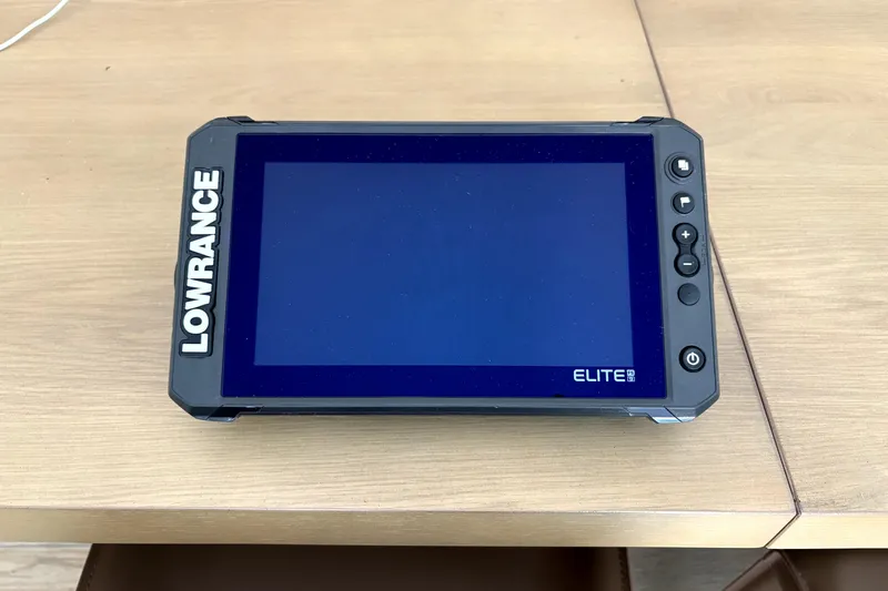 Slide: The Image of Lowrance Elite fishfinder on wooden table, compatible with 1994 Hewes Redfisher 18 boat. - 19