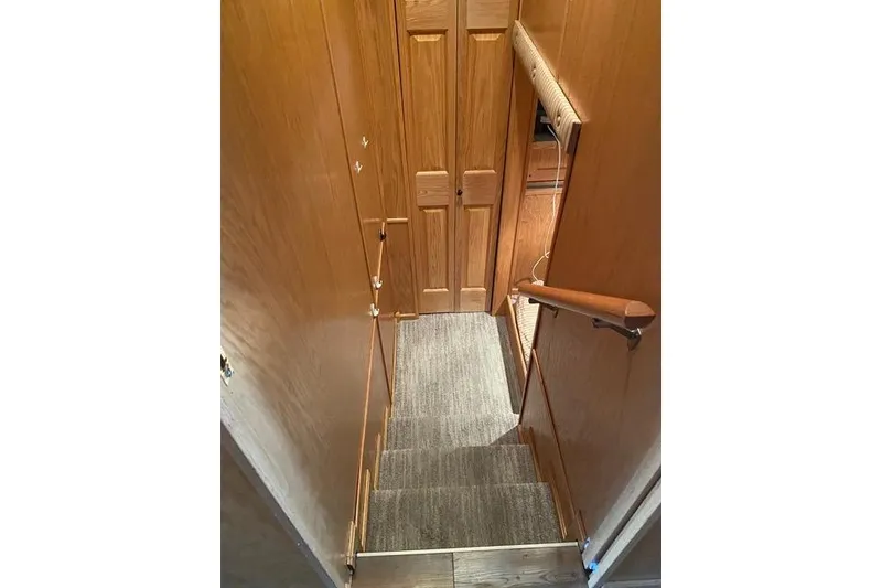 Slide: The Image of Staircase in 2005 Sumerset Starchaser, featuring wooden walls and carpeted steps. - 7