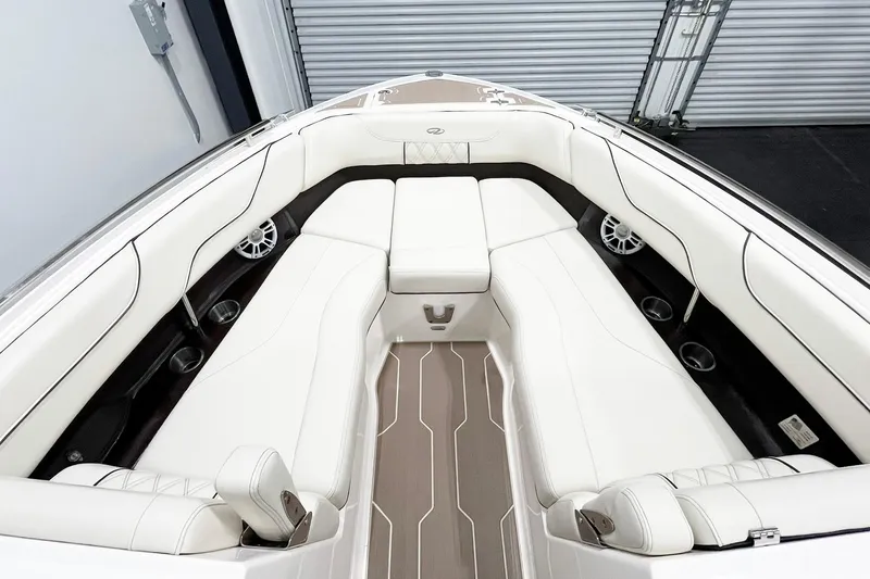 Slide: The Image of Luxurious interior of 2025 Regal LX6 boat with white seating and modern design. - 10